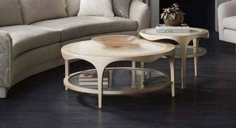 Inspired by the shapely ginkgo leaf, this occasional table mixes materials and finishes for a style that’s both casual and glamorous. Its gracefully undulating apron rail draws the eye and lends fluid simplicity. A single glass shelf adds space for display, without distracting from a white stone top and lustrous Champagne Pearl base. Style on its own, or bunch with Down and Under to create a captivating cocktail table.